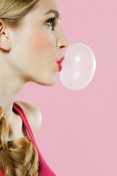 Blowing bubble gum