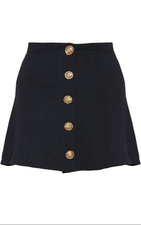 black skirt with gold buttons