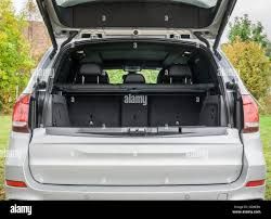 photos of suv parked with the trunk open to put shopping items in - Google Search
