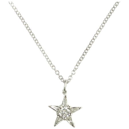 14 Karat Star Shape Pendant Has Round Cut Diamond with 5 Tapered Baguettes at 1stDibs