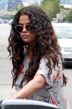 Selena Gomez Wavy Dark Brown Barrel Curls Hairstyle | Steal Her Style