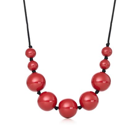 Elsa Peretti® sphere necklace in red lacquer over Japanese hardwood. | Tiffany & Co.