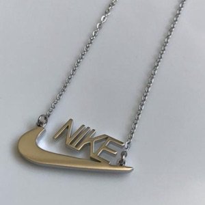 gold Nike necklace