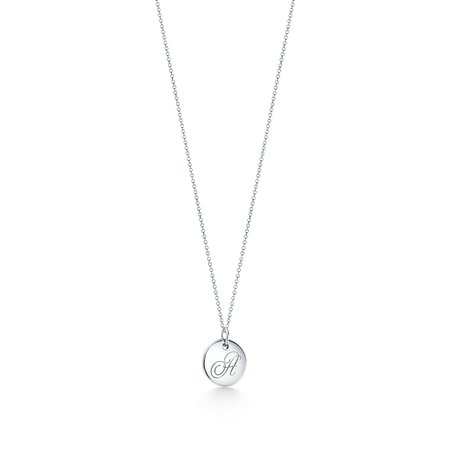 Tiffany Notes alphabet disc charm in silver, small. Letters A-Z available. | Tiffany & Co.
