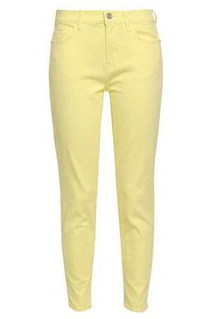 woman mid rise skinny jeans pastel yellow