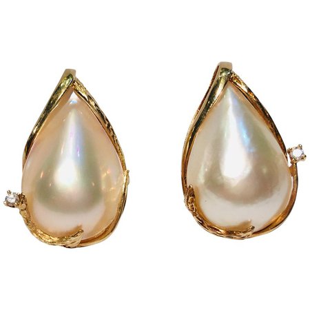 Pear Shaped Mabe Pearl Diamond Leaf Pattern 14 Karat Gold Omega Back Earrings For Sale at 1stdibs