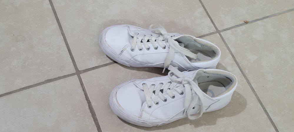 worn guess sneakers