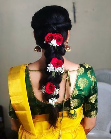 dark hair braid with red roses and white flowers