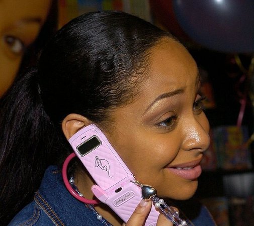 spark fashion — Raven Symone on her Baby Phat cell phone (2004)