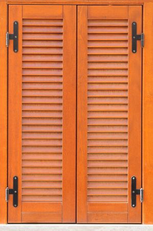 Similar images to 68752935 Window with brown shutters. Close-up view.