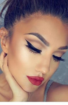 Black winged liner and red lipstick