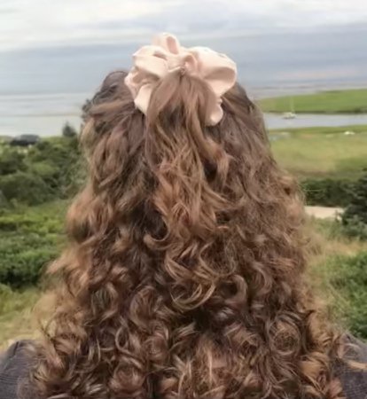 curly hair academia hairstyle with scrunchie