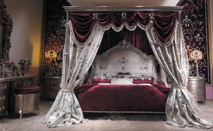 Master bed with canopy and embroidered headboard. Scarlet red