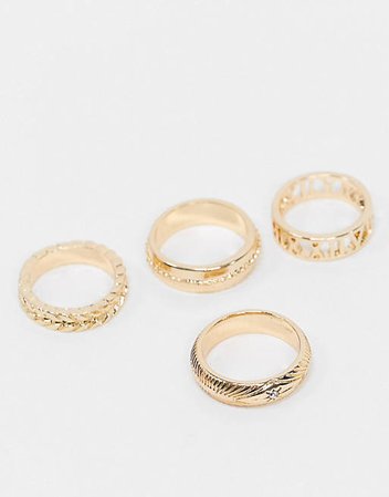 ASOS DESIGN pack of 4 rings in mixed texture and cut-out roman numerals in gold tone | ASOS