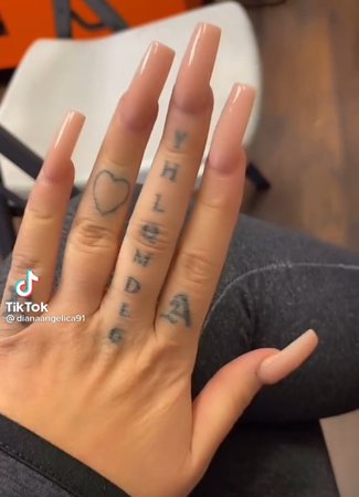 YHLQMDLG finger tattoo