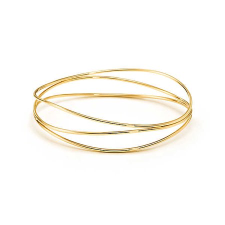 Elsa Peretti™ Wave three-row bangle in 18k gold, medium. | Tiffany & Co.