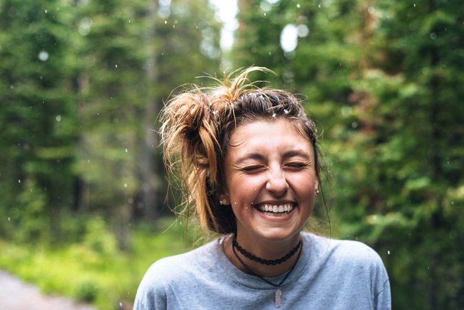 woman smiling near tree outdoor during daytime photo – Free Smile Image on Unsplash