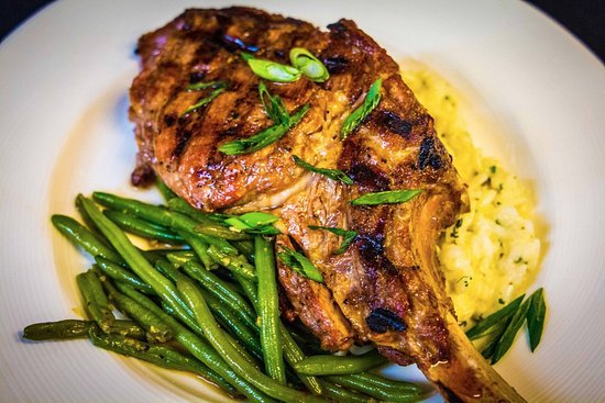 Open Range Grilled Veal Chop with Herbed Risotto and Garlic Braised Haricot Verts - Picture of Skopelos at New World, Pensacola - TripAdvisor