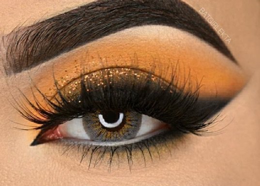 Orange/black Glittery Eye Makeup
