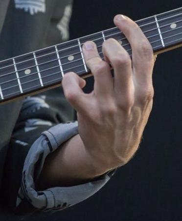 hand playing guitar