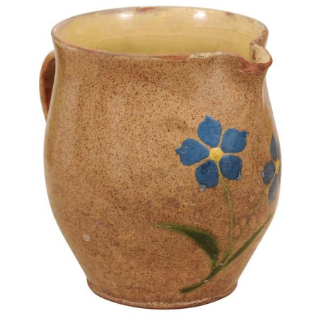 French 19th Century Rustic Pottery Pitcher with Mustard Glaze and Blue Flowers For Sale at 1stDibs