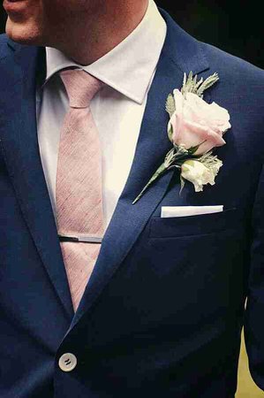 rose gold tie with navy suit