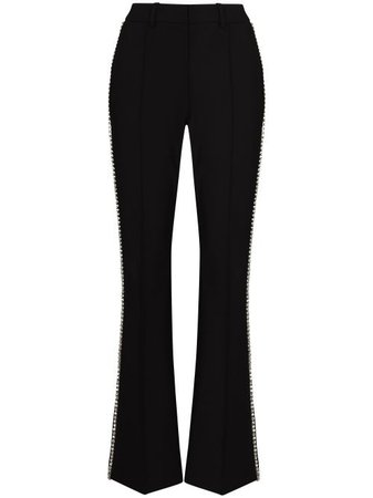 Shop black AREA embellished-trim flared trousers with Express Delivery - Farfetch