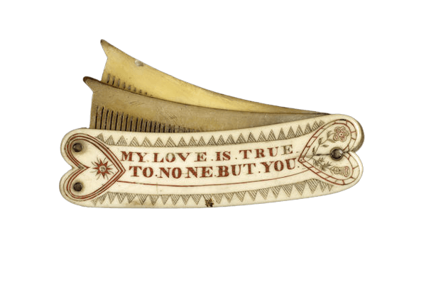 A scrimshawed and polychromed double comb, sailors love token, British, mid 19th century
