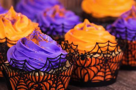 Orange And Purple Halloween Cupcakes With Sprinkles Stock Photo, Picture And Royalty Free Image. Image 87330199.