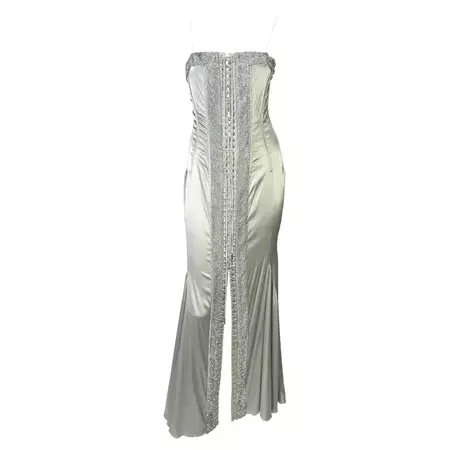 S/S 2004 Dolce and Gabbana Runway Rhinestone Lace-Up Silver Stretch Satin Gown For Sale at 1stDibs | cowl neck lace up rhinestone back long satin dress, dolce and gabbana rhinestone dress, silver rhinestone dress