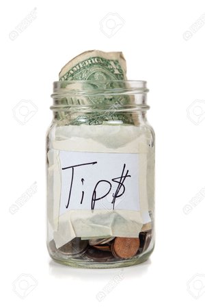 a tip jar with coins and bills