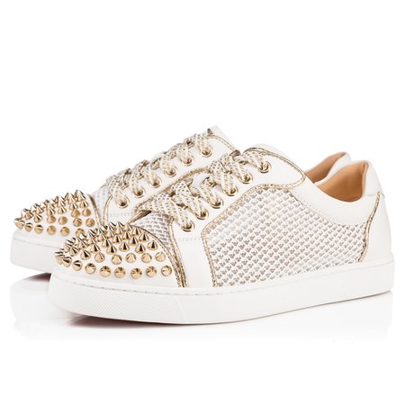White sneakers with gold spikes