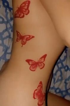 red butterflies tattoo