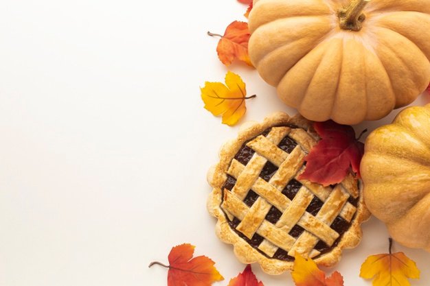 Free Photo | Above view frame with pumpkin and pie