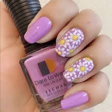 purple nails holdinb purple nail polisn - Google Search