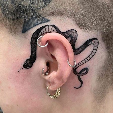 snake ear tattoo