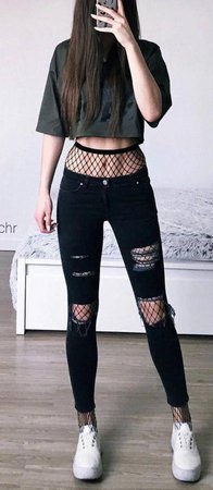 black ripped jeans over fishnets