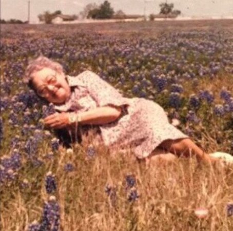adorable vintage photo of someone’s grandmother in a meadow