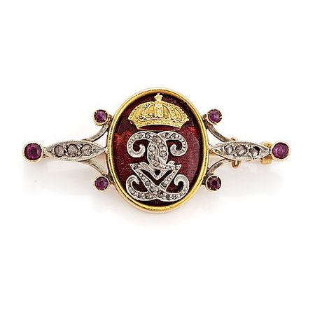 An 18K gold and enamel brooch set with rose-cut diamonds and faceted rubies. - Bukowskis