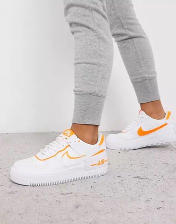 white & orange trainers