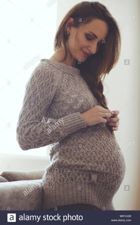home-cozy-portrait-of-pregnant-woman-wearing-warm-cashmere-sweater-resting-at-home-WKYJG9.jpg (866×1390)
