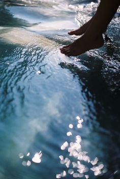 feet near the water aesthetic