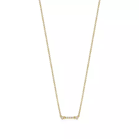 Tiffany Fleur de Lis key bar pendant in 18k gold with diamonds. | Tiffany & Co.