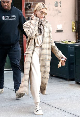 Hailey Baldwin Bieber in a MM6 Maison Margiela coat and Chloe jumper and trousers | About Her